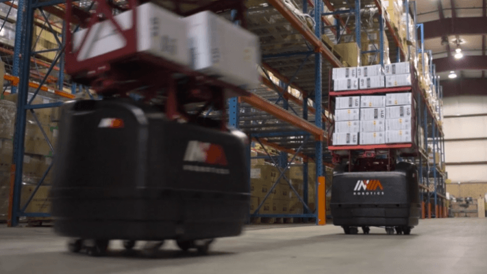 invia AMR robot transporting goods in warehouse