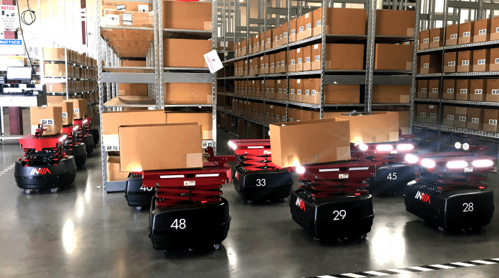 inVia picking robots lined up in warehouse moving goods
