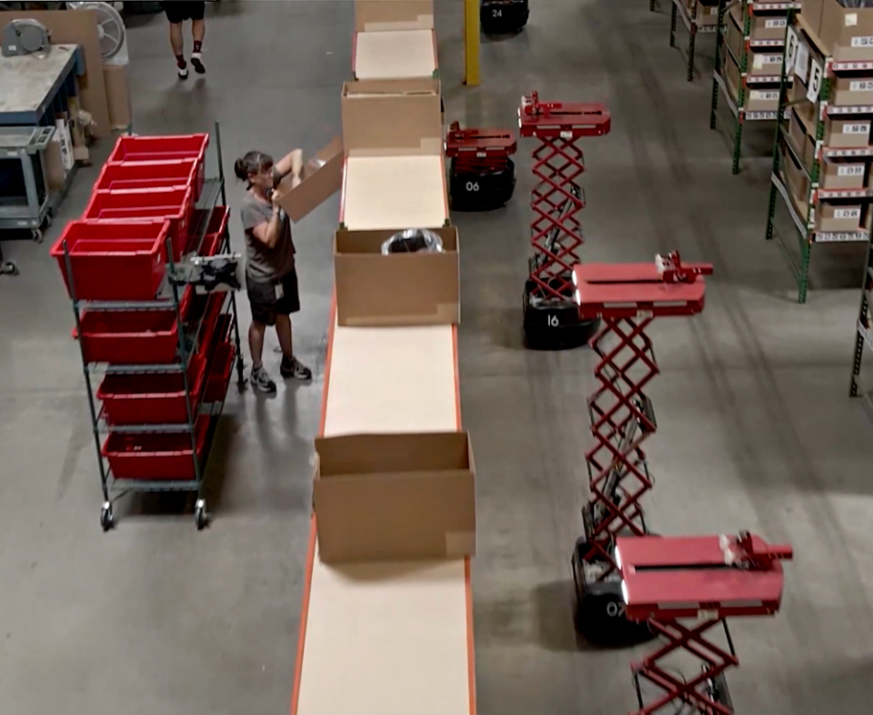 Picker Robots In Warehouse Aisles